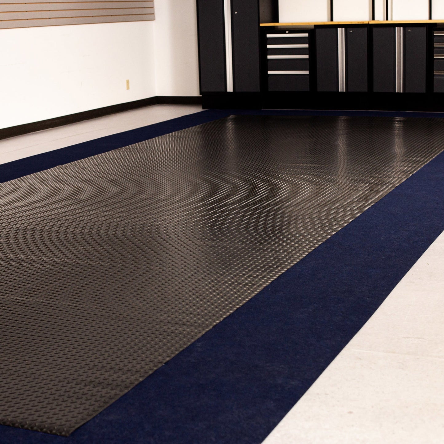 Blue Drip & Dry Absorbent Runner next to Midnight Black Diamond Tread vinyl flooring